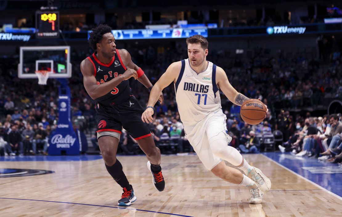 Doncic drives to the basket as Raptors forward OG Anunoby defends.