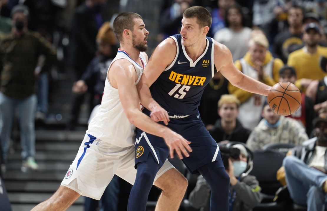 Jokic is defended by Los Angeles Clippers center Ivica Zubac during overtime.