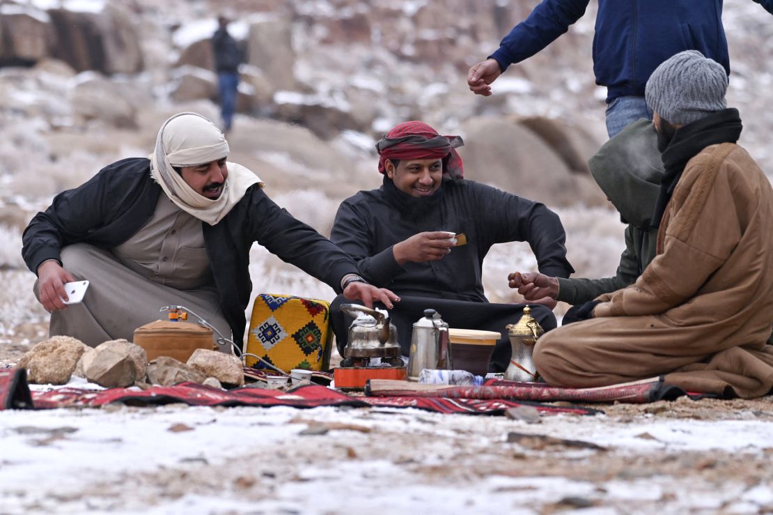 Saudis melt snow for coffee in Jabal al-Lawz near Tabuk.