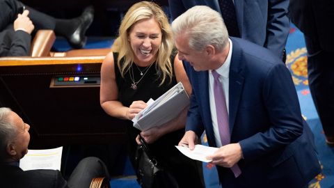 Rep. Marjorie Taylor Greene, at left, speaks with House Minority Leader Kevin McCarthy in June, as the House votes on creating a committee to investigate the January 6 insurrection.