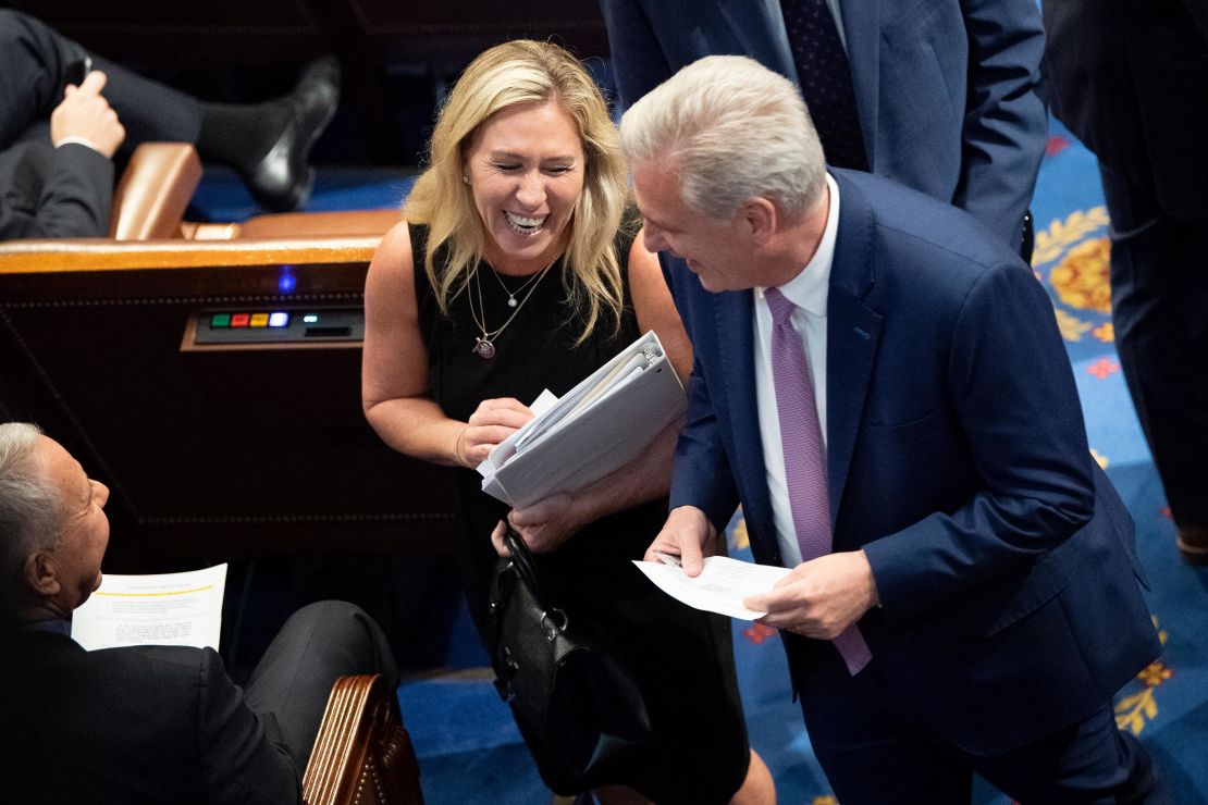 Rep. Marjorie Taylor Greene, at left, speaks with House Minority Leader Kevin McCarthy in June, as the House votes on creating a committee to investigate the January 6 insurrection. 