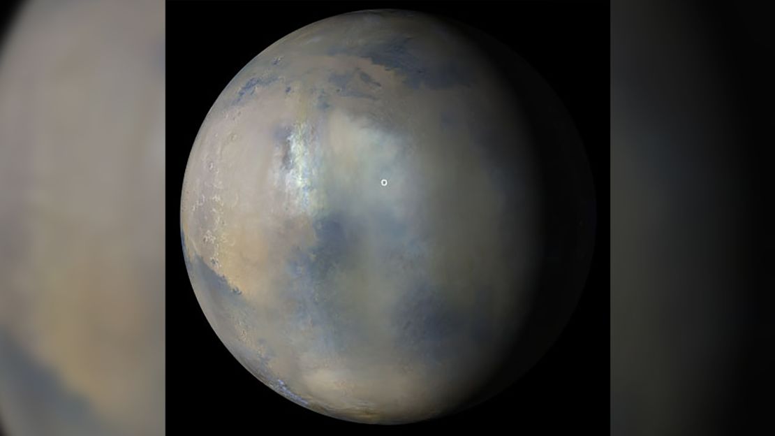NASA's Mars Reconnaissance Orbiter took images on January 9 showing the presence of a regional dust storm over the location of Perseverance rover and Ingenuity helicopter ( marked by the white circle). 