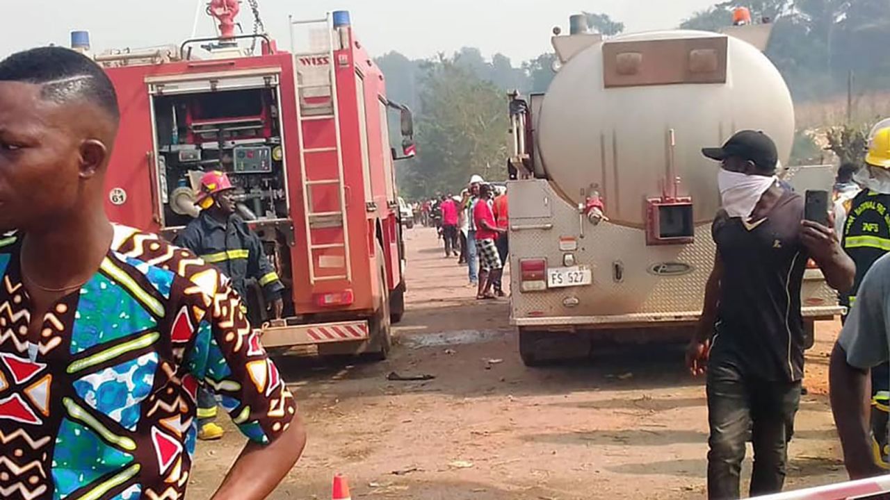 Rescue workers arrive at the scene of the explosion in Apiate on Thursday.