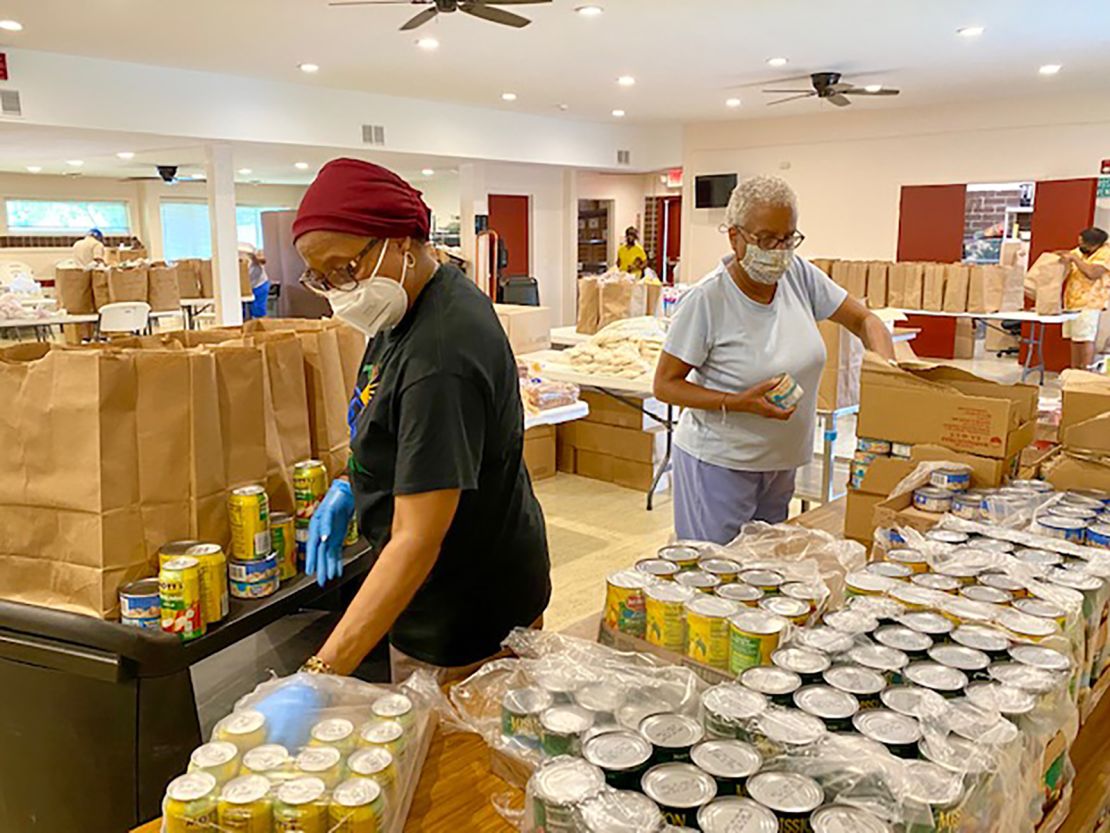 Volunteers organize food boxes at Beyond the Sanctuary, a non-profit organization in Rochester, New York, in June 2021.