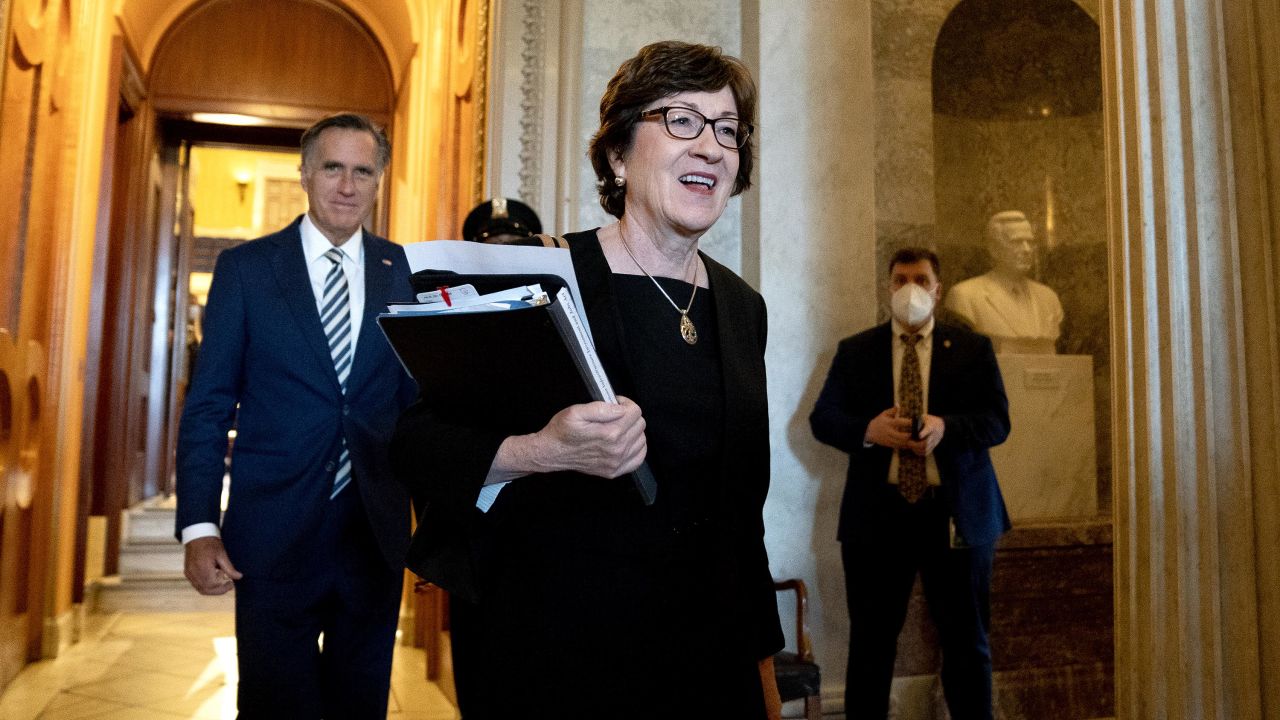 Republican Sens. Susan Collins of Maine and Mitt Romney of Utah depart the Senate Chamber on Friday, July 30, 2021. 