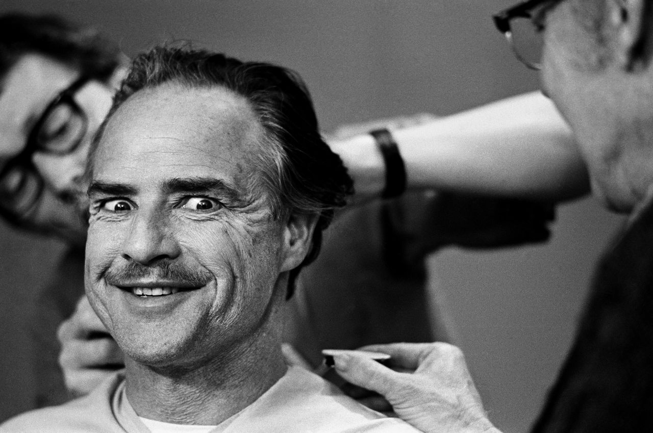 Actor Marlon Brando has his hair and makeup done as he transforms into Don Corleone in the 1972 film "The Godfather."