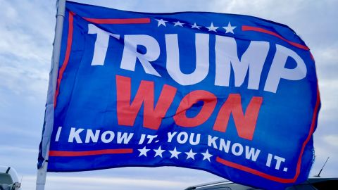 A large flag declaring the Big Lie of the 2020 election flies in Florence, Arizona, ahead of a rally by former President Donald Trump.