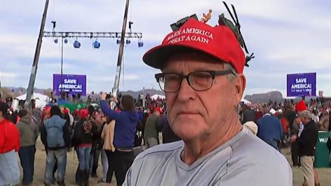 Ross Hager proudly wears an adored Make America Great Again hat as he waits to enter a Trump rally.