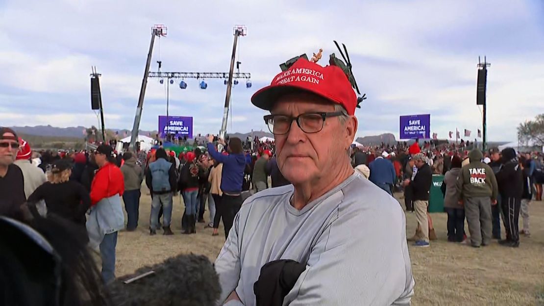 Ross Hager proudly wears an adored Make America Great Again hat as he waits to enter a Trump rally.