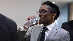 Stop the Steal organizer Ali Alexander takes a sip of water as he returns to a conference room for a deposition meeting on Capitol Hill with the House select committee investigating the January 6th attack on December 9, 2021 in Washington, DC. 