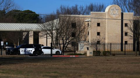 Police vehicles sit outside of Congregation Beth Israel Synagogue in Colleyville, Texas, on January 16, a day after the hostage situation.