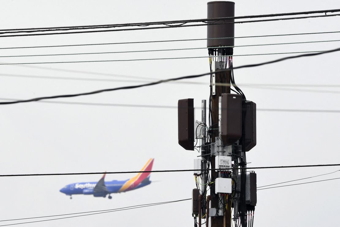 A 5G cellular tower stands as a Southwest Airlines Co. Boeing 737 airplane lands at Los Angeles International Airport (LAX) in the Lennox neighborhood of Los Angeles, California, on January 19.