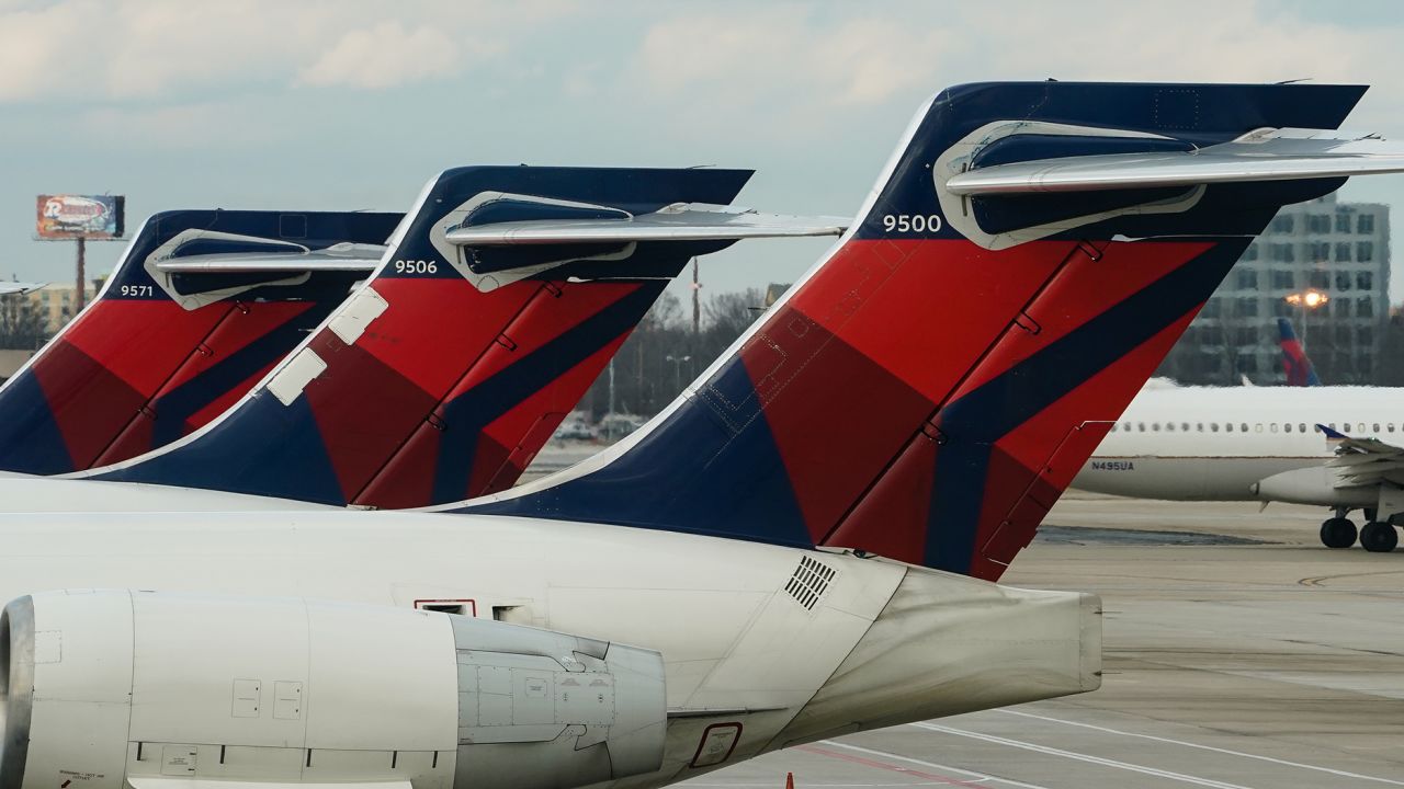 A row of Delta Air Lines planes at Hartsfield-Jackson Atlanta International Airport in Atlanta, Georgia, Monday, Dec. 27, 2021.