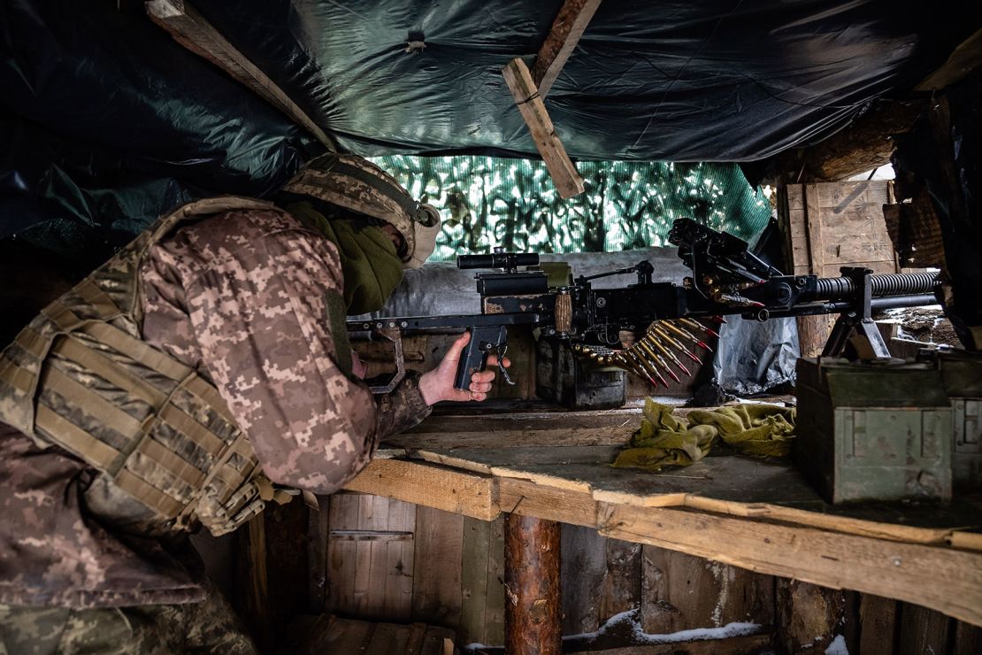 A Ukrainian soldier at a gunner position in a trench on the front line, 500 yards from separatists' positions, Friday, January 21, 2022, in Slov'yanoserbs'k, Luhansk region of Ukraine.