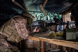 A Ukrainian soldier at a gunner position in a trench on the front line, 500 yards from separatists' positions, Friday, January 21, 2022, in Slov'yanoserbs'k, Luhansk region of Ukraine.