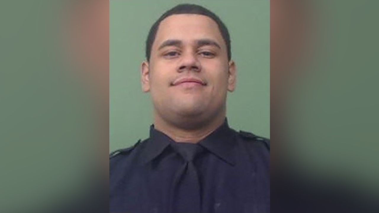 NYPD Officer Wilbert Mora, 27, was in critical condition after he was shot in a Harlem apartment.