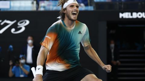 Tsitsipas celebrates victory in his third-round singles match against Paire.