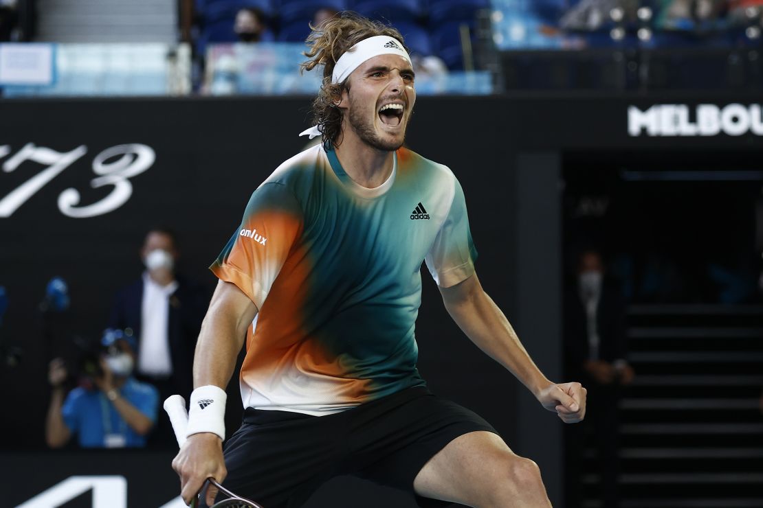 Tsitsipas celebrates victory in his third-round singles match against Paire.