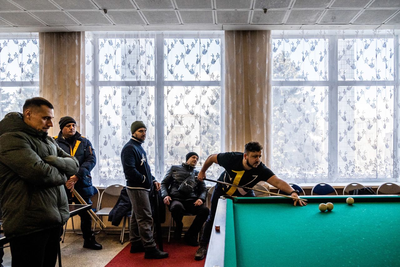 Men play billiards in Marinka during a local tournament.
