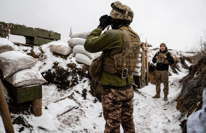 Ukrainian soldiers guard a front-line trench position.