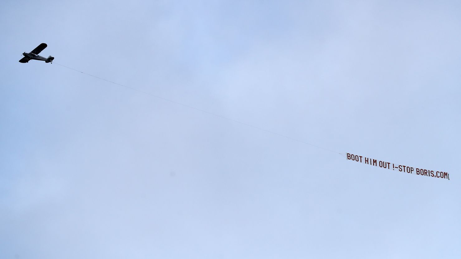 A plane flies over the stadium with a message directed to UK Prime Minister Boris Johnson during the Premier League match between Leeds United and Newcastle United at Elland Road.