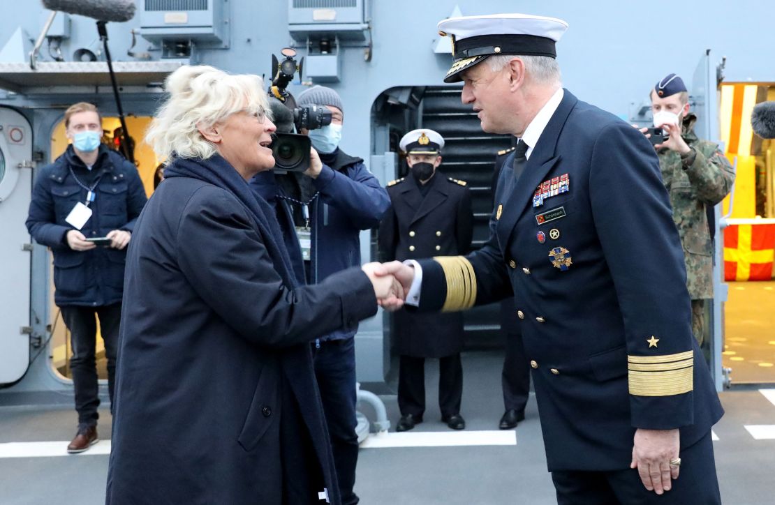 Vice-Admiral Kay-Achim Schönbach greets German Defense Minister Christine Lambrecht onboard the corvette "Oldenburg" on December 17, 2021.