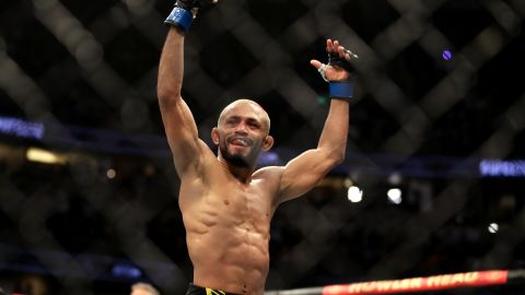 Figueiredo celebrates after defeating Moreno in their flyweight title bout.