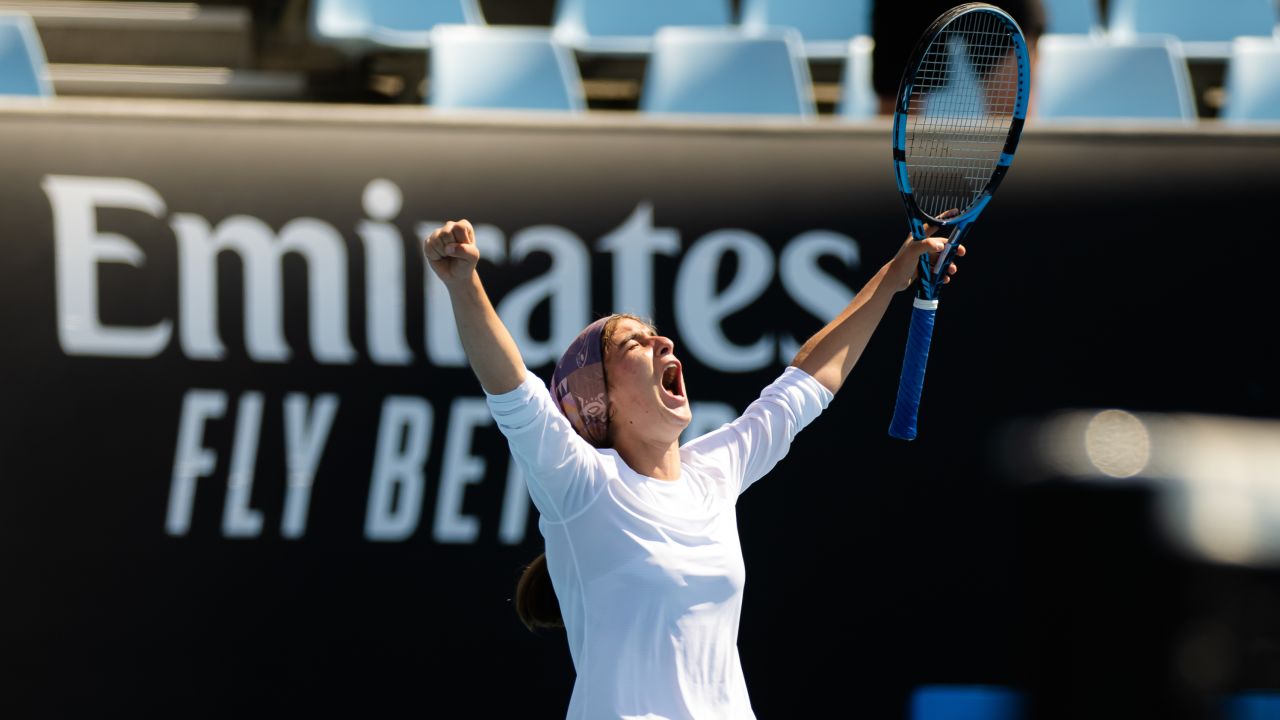 Meshkat al-Zahra Safi of Iran celebrates winning in the first round of the Australian Open junior event. 