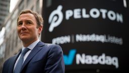 John Foley, co-founder and chief executive officer of Peloton Interactive Inc., stands for a photograph during the company's initial public offering (IPO) in front of the Nasdaq MarketSite in New York, on Sept. 26, 2019. 
