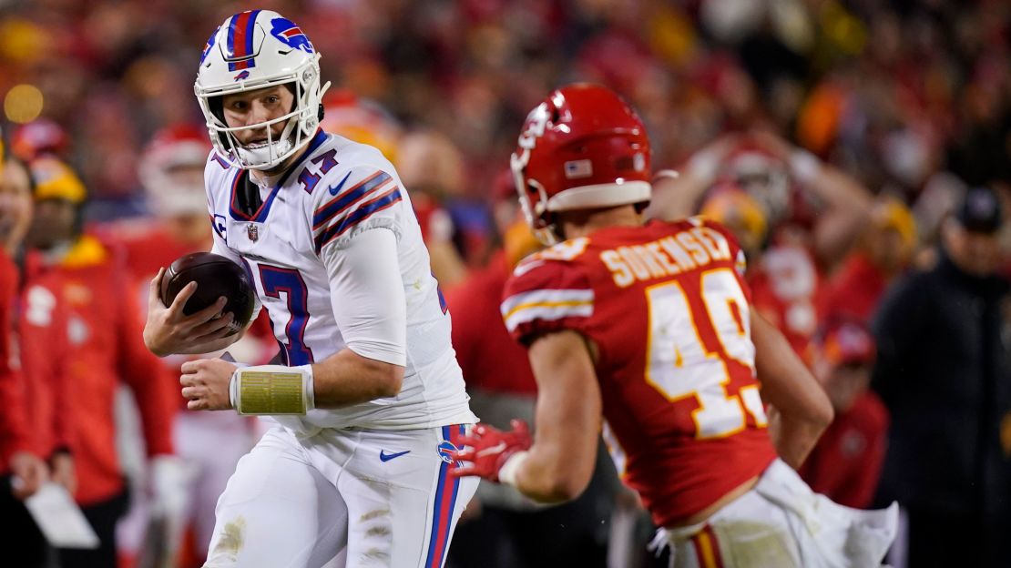 Allen runs from Kansas City Chiefs safety Daniel Sorensen during the second half. 