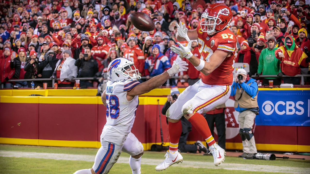 Kansas City Chiefs tight end Travis Kelce (87) reaches for the game winning reception over Buffalo Bills outside linebacker Matt Milano (58) during the AFC Divisional Round playoff game on January 23rd, 2022.