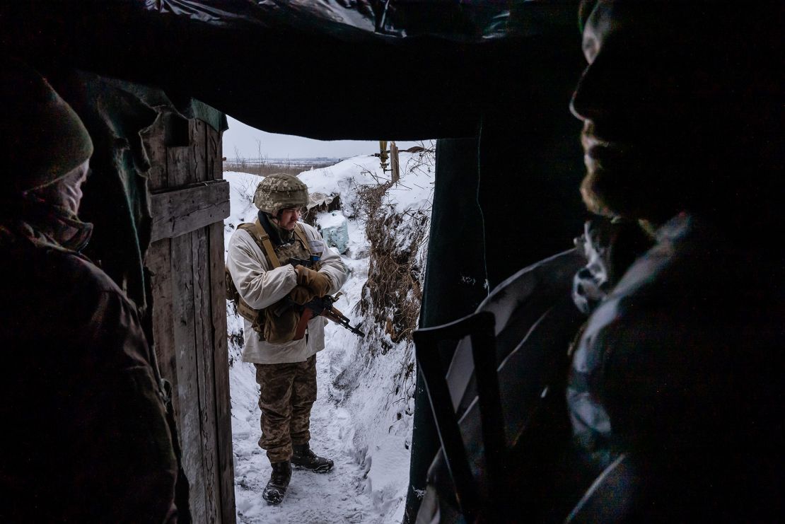 Ukrainian soldiers in a front line trench position in Donbas take shelter from the extreme cold.