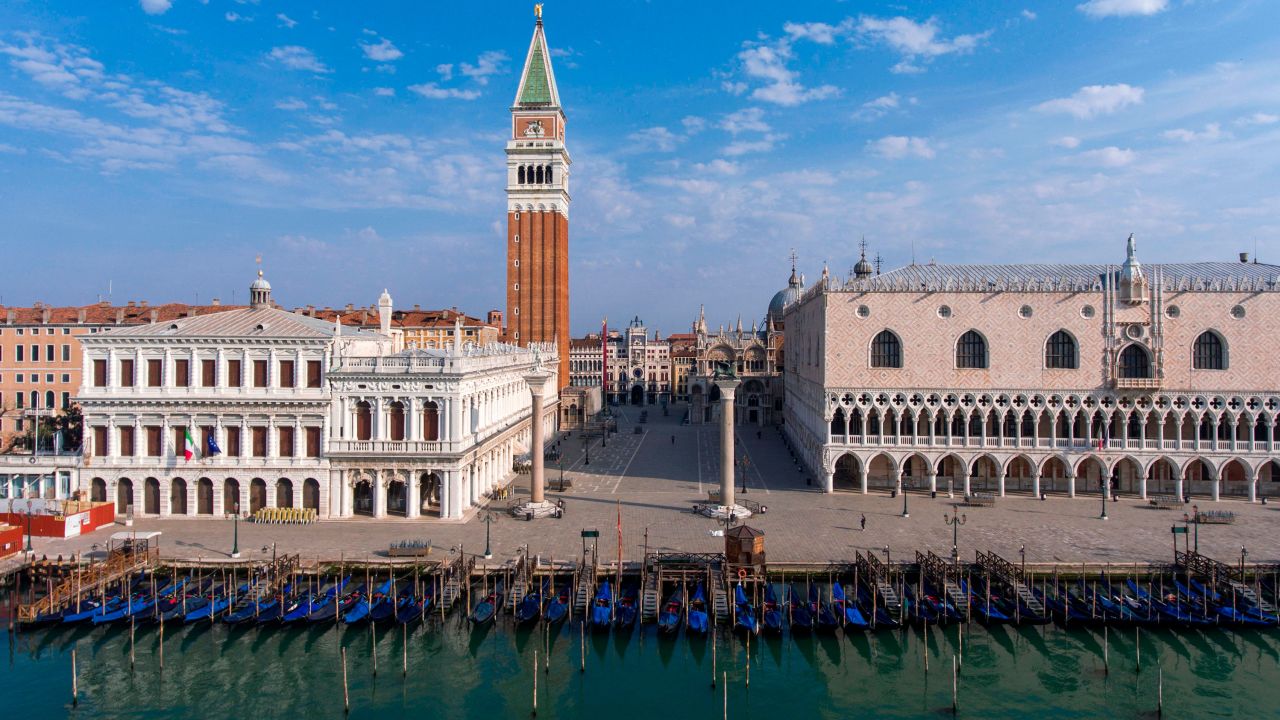 An aerial view taken on April 25, 2020 over Venice shows St. Mark's Square (Piazza San Marco), the Bell Tower, the Doges Palace and gondolas moored at the Riva degli Schiavoni embankment during the country's lockdown aimed at curbing the spread of the COVID-19 infection, caused by the novel coronavirus. (Photo by MARCO SABADIN / AFP) (Photo by MARCO SABADIN/AFP via Getty Images)