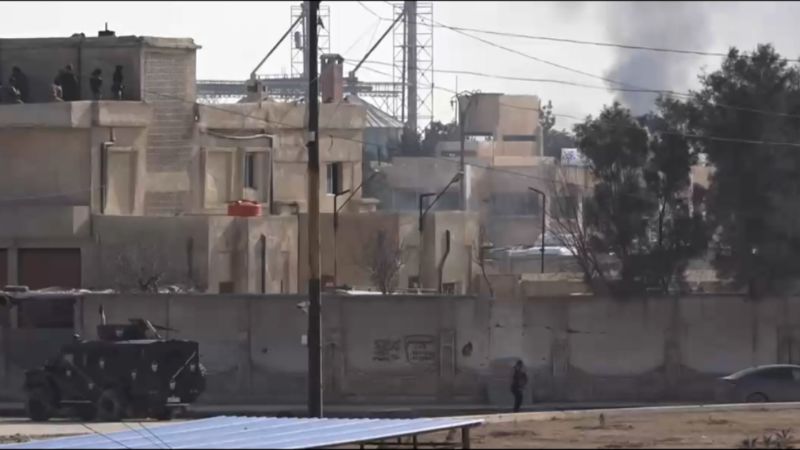 shows US-backed forces clashing as ISIS militants attempt prison break