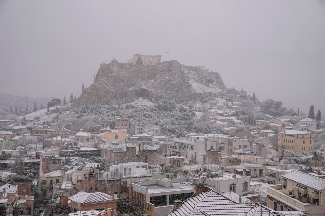 The Parthenon temple atop the ancient Acropolis hill, seen covered with snow on Monday.