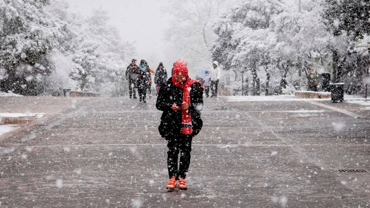 Snow falling in the center of Athens, Greece on Monday.
