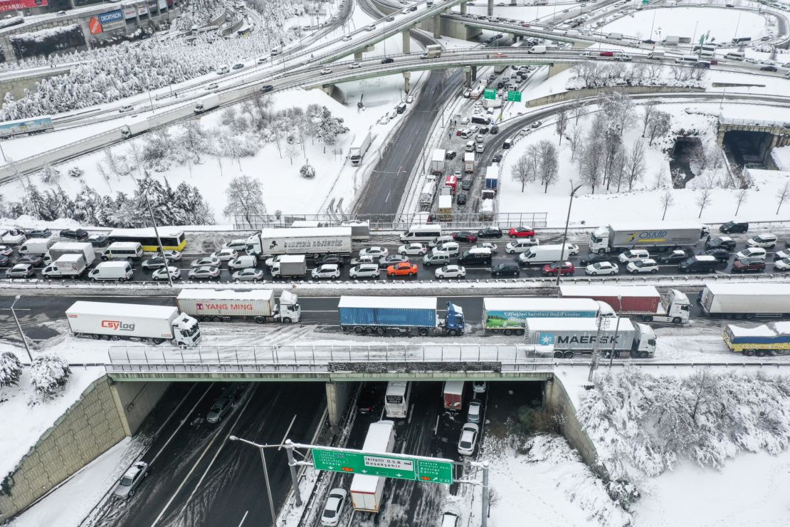 Vehicles stuck on a snow-covered road after heavy snowfall hit Istanbul.
