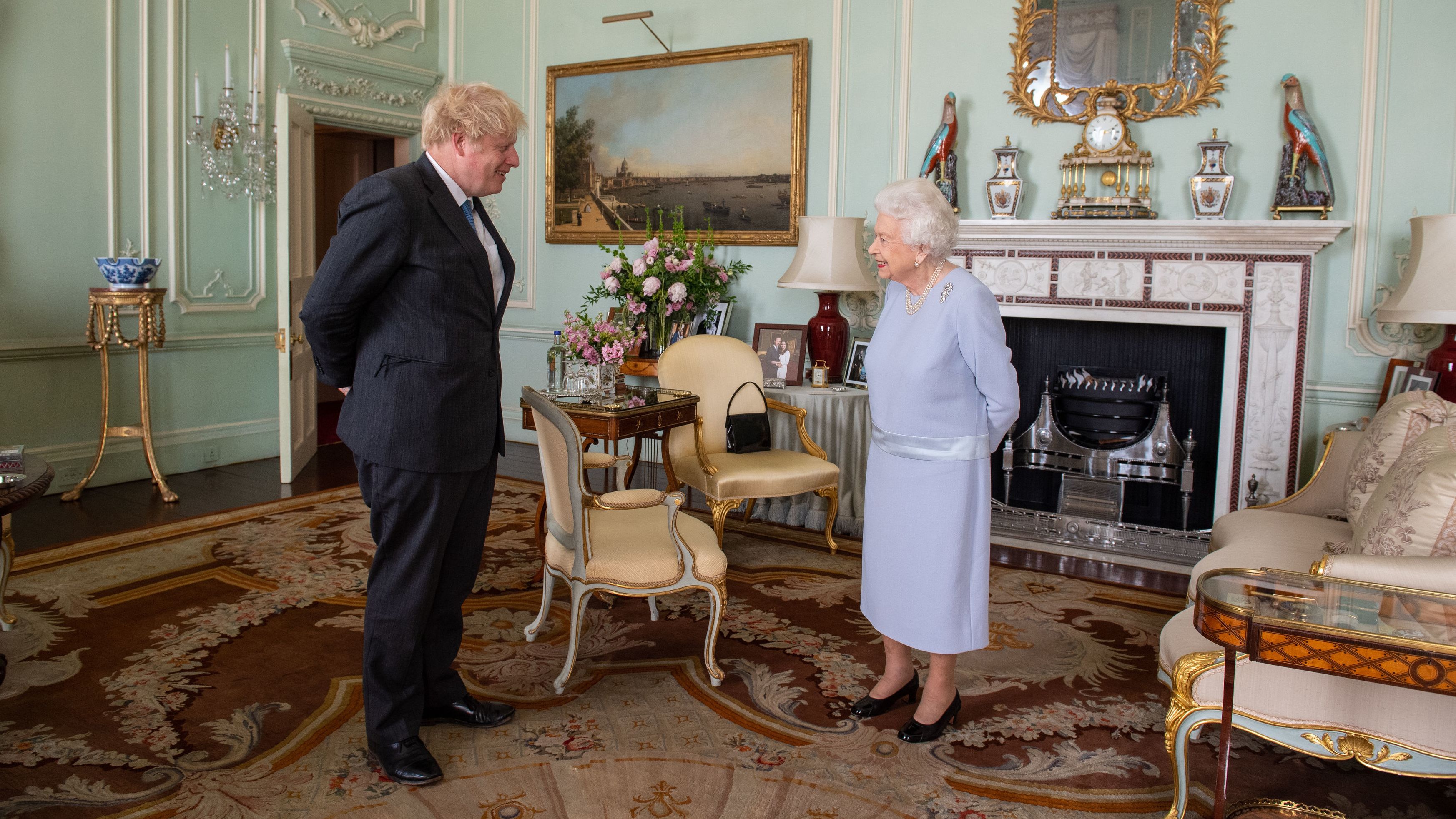 Queen Elizabeth II greets Johnson at Buckingham Palace in June 2021. It was the Queen's first in-person weekly audience with the Prime Minister since the start of the coronavirus pandemic.