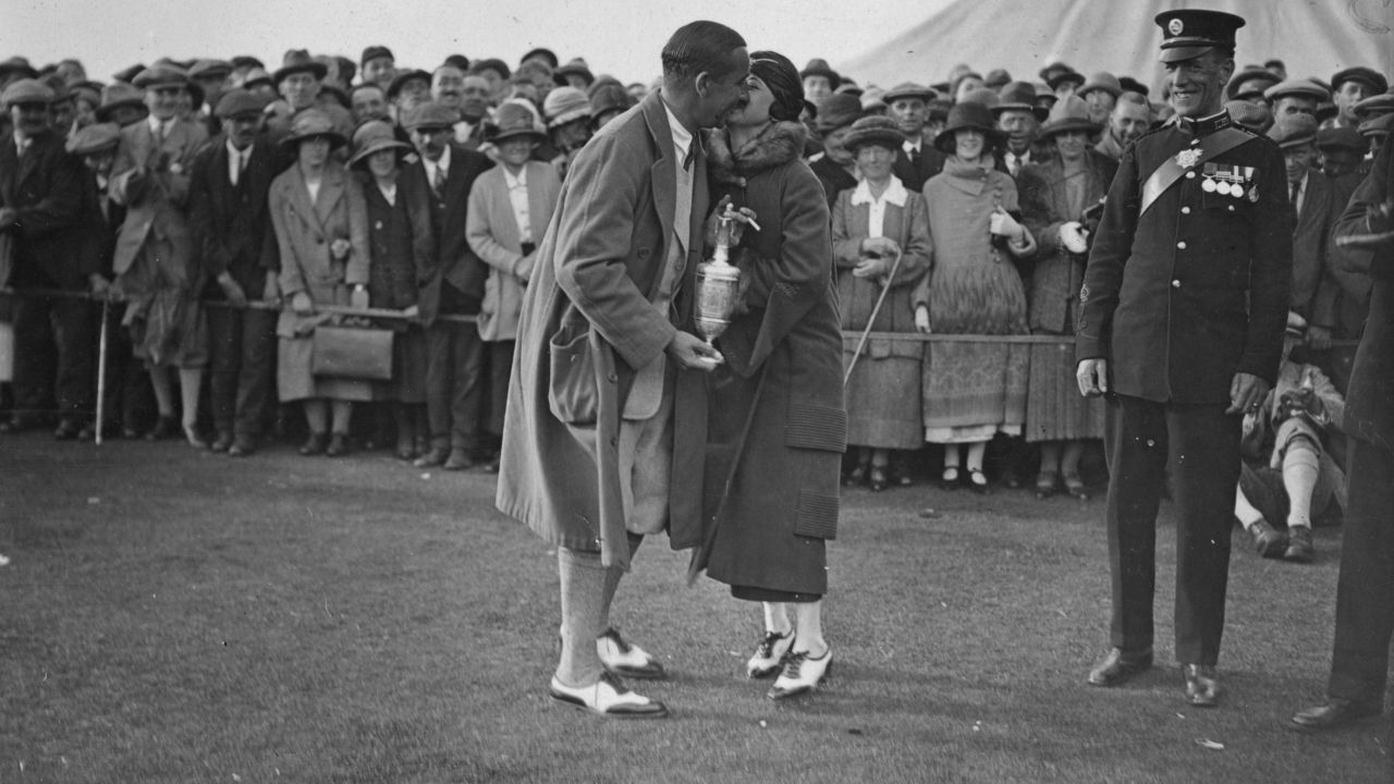 Hagen, winner of the British Open Golf Championship at Hoylake, kissing his wife.