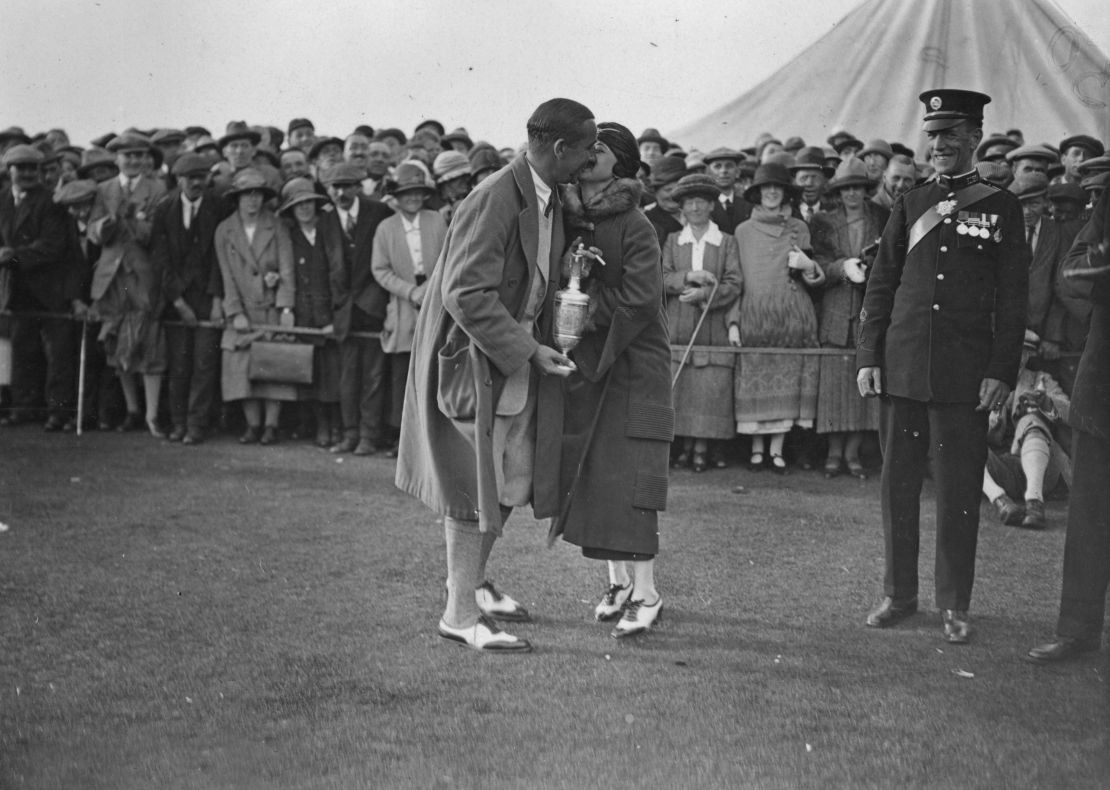 Hagen, winner of the British Open Golf Championship at Hoylake, kissing his wife.