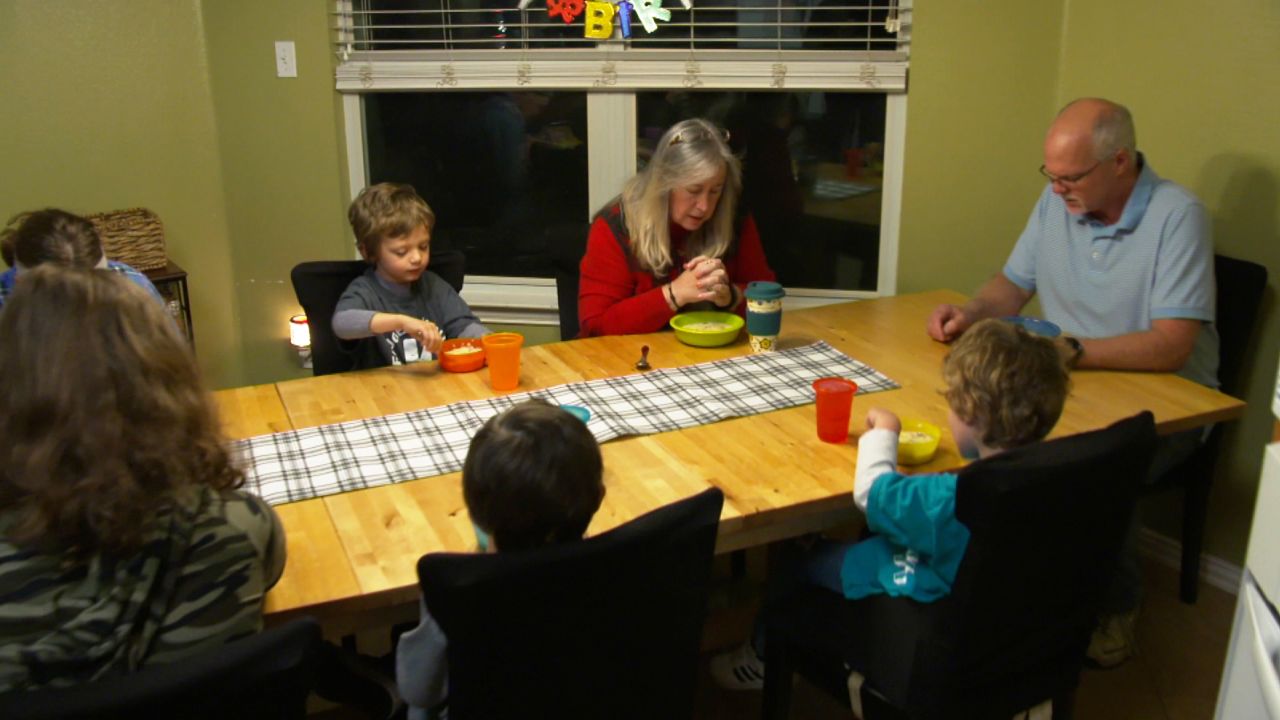 Jan Stone prays with her family at breakfast before they head off to school