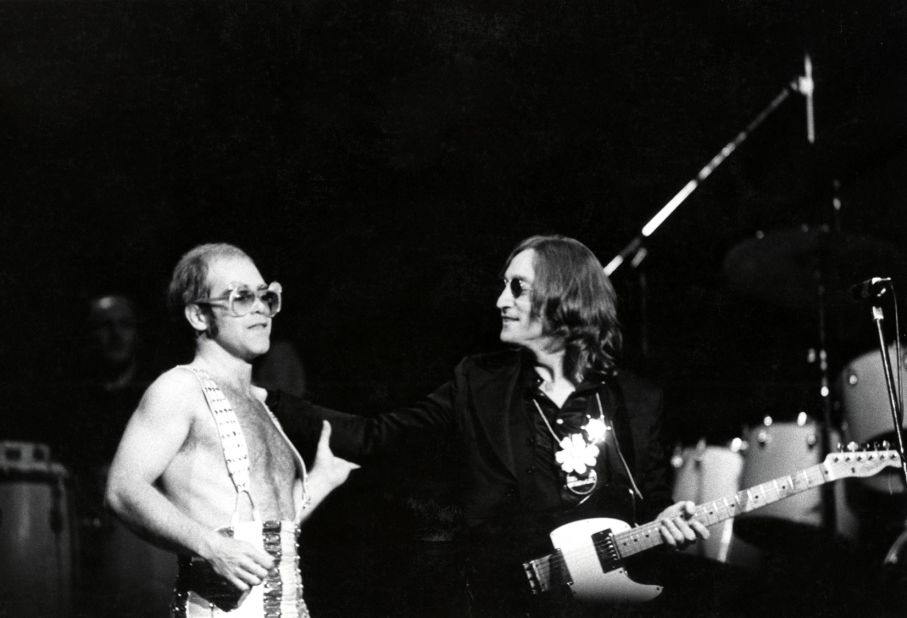 John appears on stage with John Lennon at New York's Madison Square Garden in 1974.