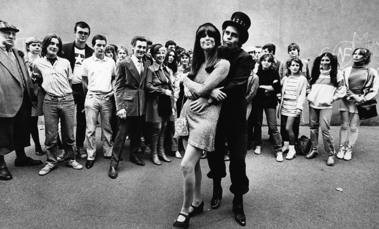 Fans watch John embrace singer and friend Kiki Dee in 1978. The two had a No. 1 hit, "Don't Go Breaking My Heart," in 1976.