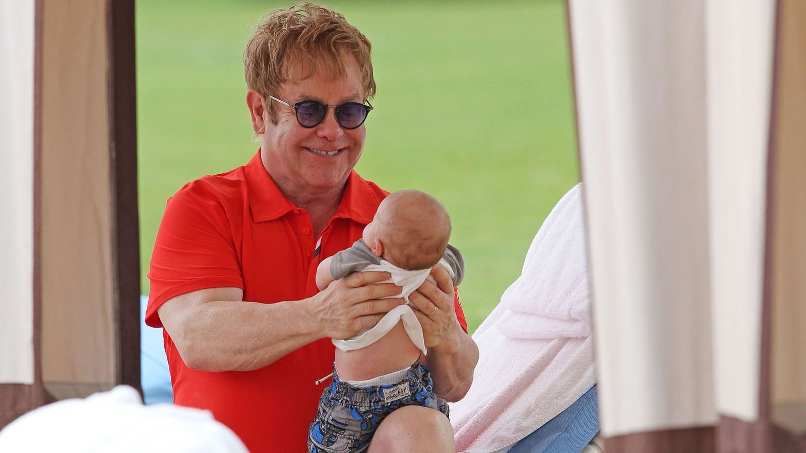 John holds his son Zachary Jackson Levon in 2011. John and his longtime partner, David Furnish, had the baby through a surrogate. They later welcomed a second son to their family, Elijah Joseph Daniel.