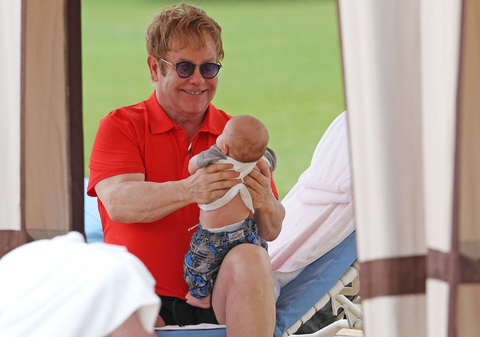 John holds his son Zachary Jackson Levon in 2011. John and his longtime partner, David Furnish, had the baby through a surrogate. They later welcomed a second son to their family, Elijah Joseph Daniel.