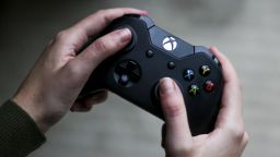 A person uses a Microsoft's Xbox One video game controller in Denver, Colorado, on Wednesday, January 19.
