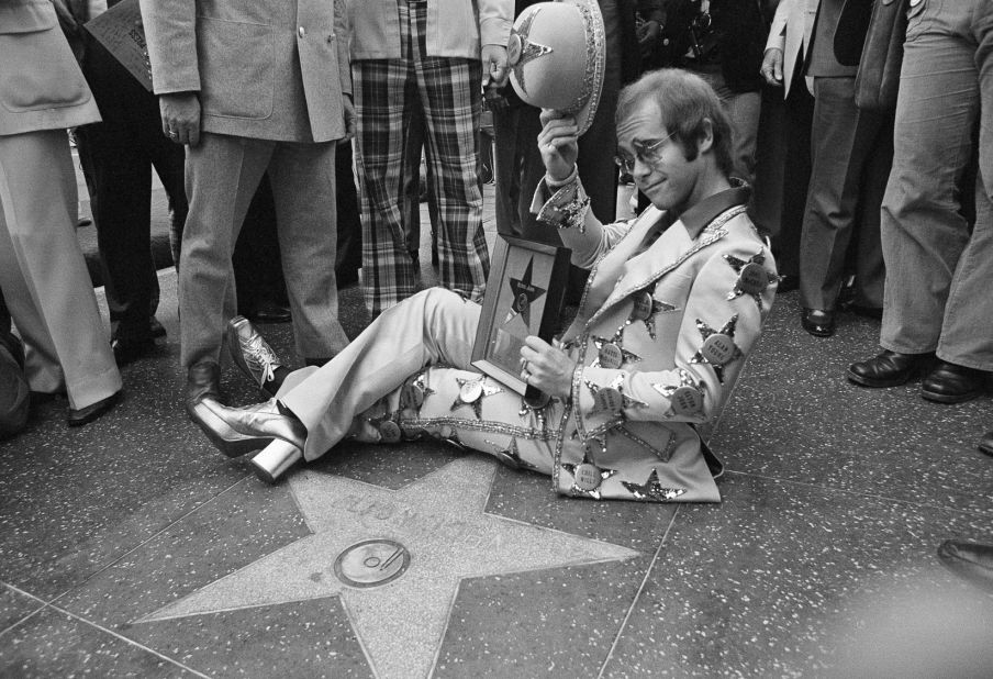 John tips his hat after having a star dedicated to him on the Hollywood Walk of Fame in 1975.