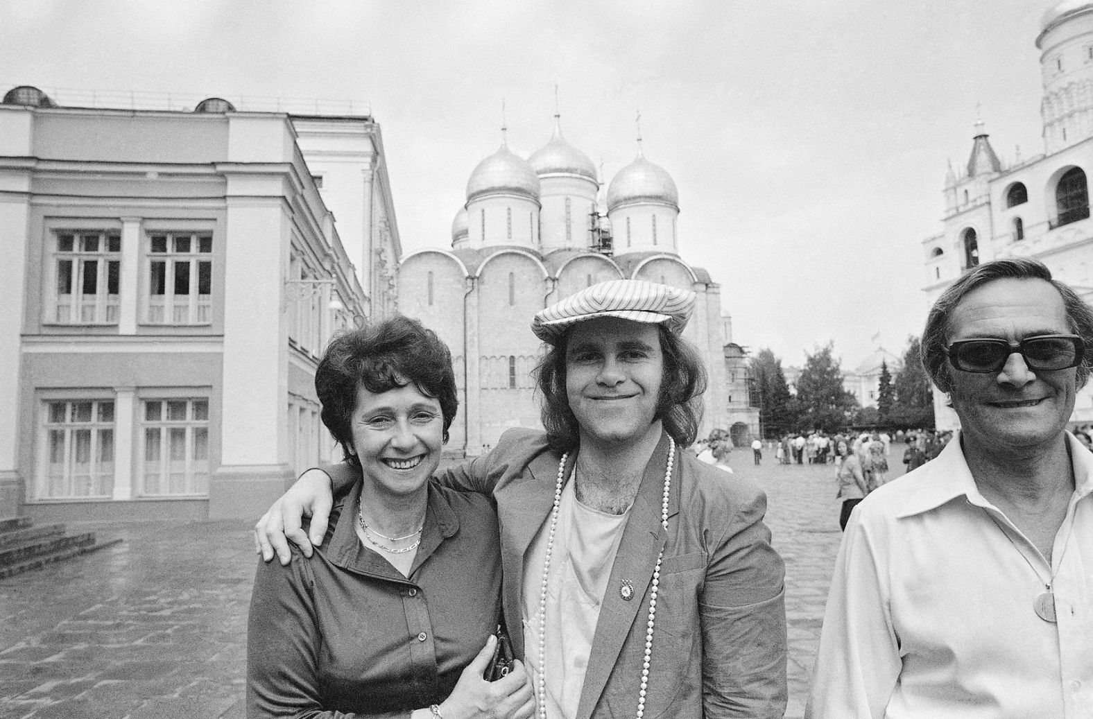 John poses with his mother and stepfather while touring the Kremlin in Moscow in 1979. He was the first rock or pop star from the West to perform in the Soviet Union.
