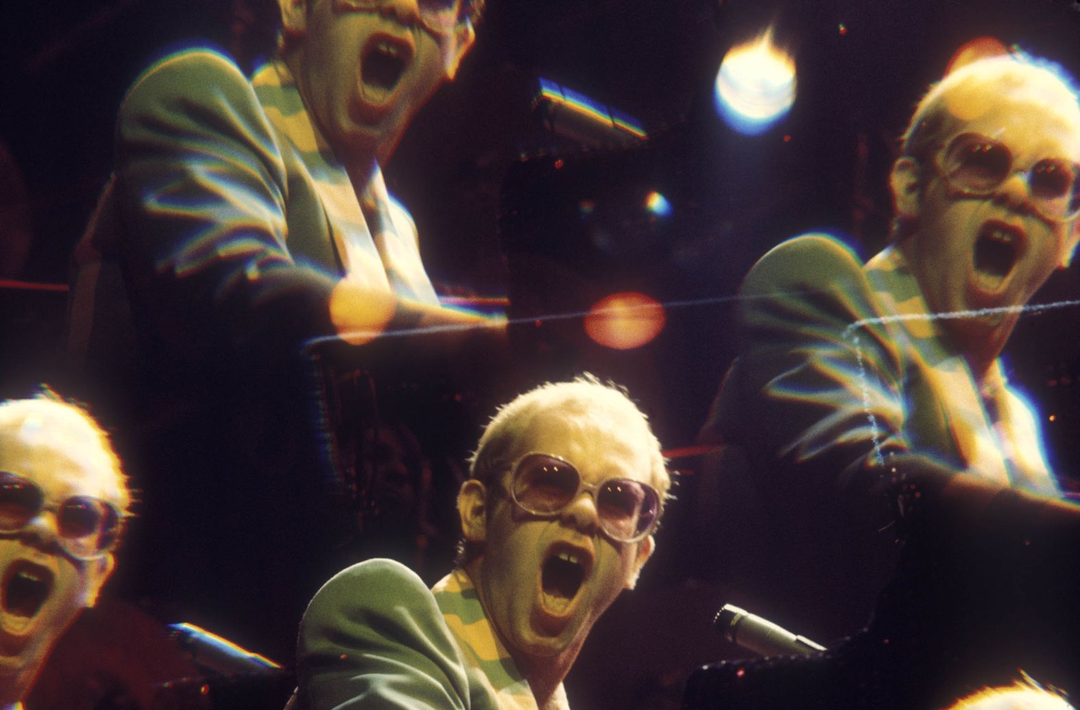 John performs at Earl's Court, a popular arena in London, in the late 1970s.