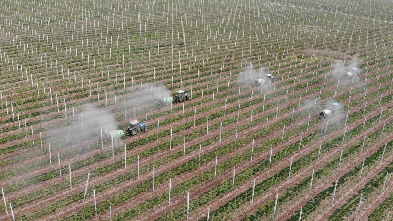 Farm tractors at an apple planting base in Zhenyuan County, Qingyang City, China, on May 22, 2020. 
